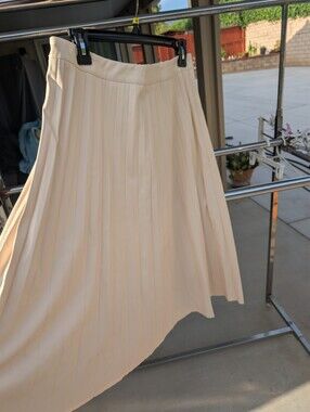Asymmetrical Pleated Skirt in Cream Faux Leather